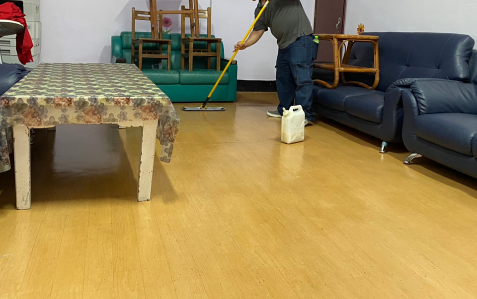 worker-mopping-wooden-floor-clean