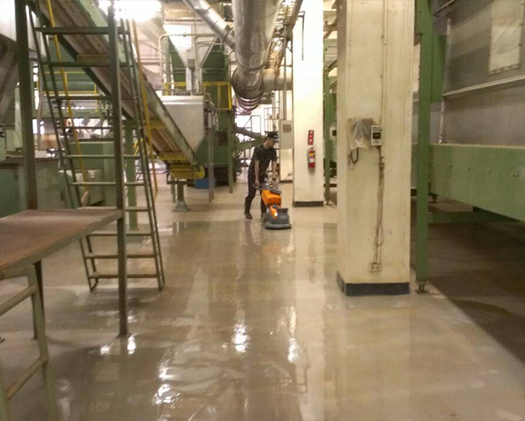 worker-waxing-cleaning-factory-floor