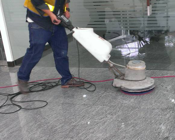 worker-waxing-marble-floor
